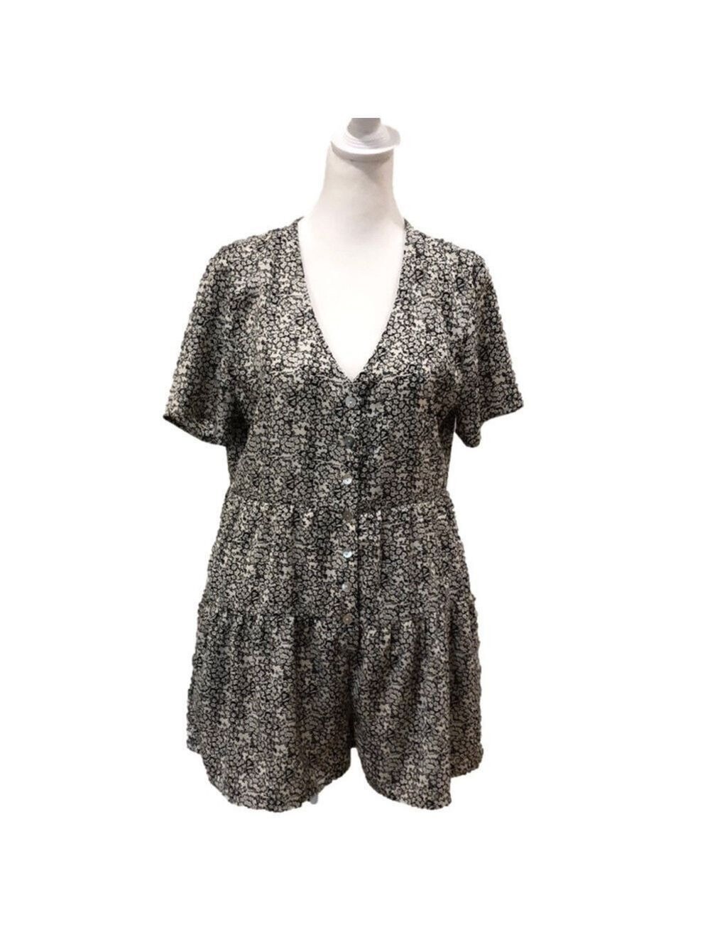 ENTRO romper. Black and white floral print. Short sleeves. Button front. Size M